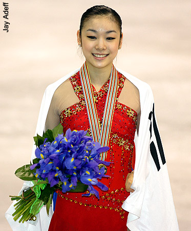 World Champion Yu-Na Kim draped in South Korea's flag