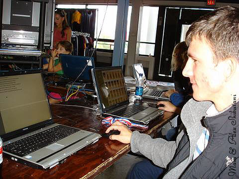 Augie Hill reviews photos at Bob Ewell's kiosk