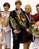 The happy medalists pose for photographers