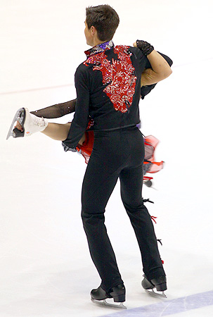 Three legs, one head, indeterminate number of arms