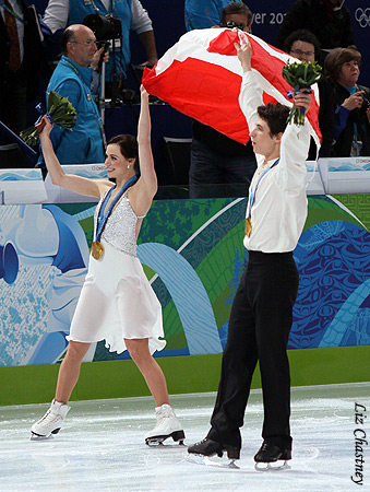Virtue &amp; Moir raise their flag