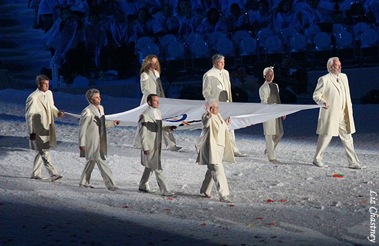 The Olympic flag enters the arena
