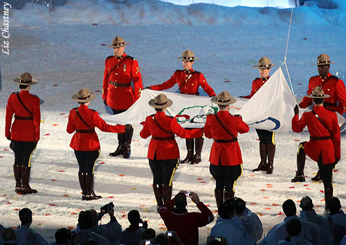 preparing to raise the Olympic flag