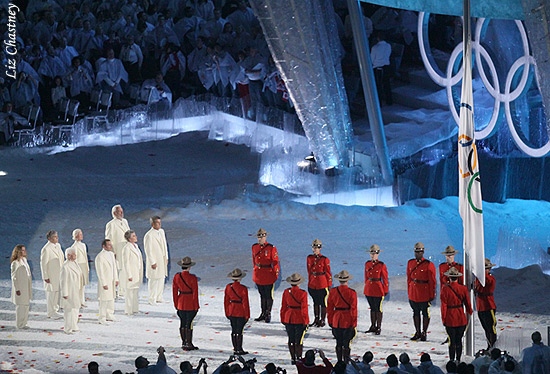 Raising the Olympic flag