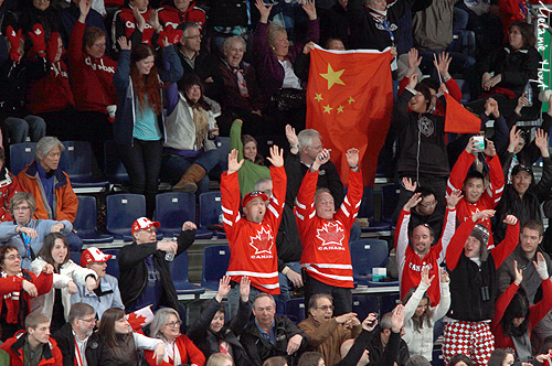 Curling fans do the wave!