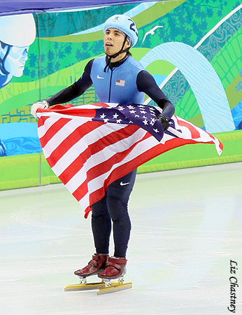 Apolo Anton Ohno with the American flag