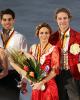 The medalists pose for photos