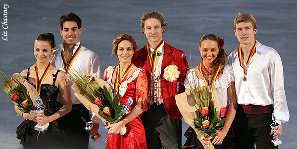 The medalists pose for photos