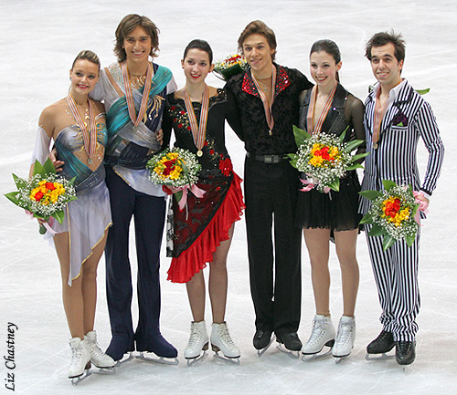 The ice dance medalists pose for photos