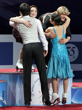 Maia &amp; Alex hug World Champions Meryl &amp; Charlie