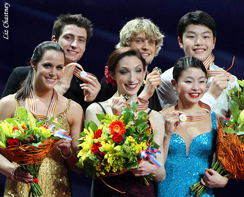 The 2011 champions show off their medals in Moscow