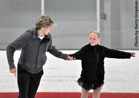 White works with a dancer on stroking