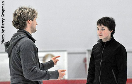 White works one-on-one with an ice dancer