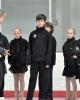The young ice dancers listen intently to White and Belbin's instruction
