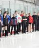 Novice ice dancers line up and listen to White
