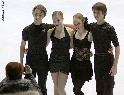 Coach Carol Lane takes a photo of (L-R) Dennis Romanenko, Abby Savoie, Katie Desveaux, and Dmitre Razgulajevs