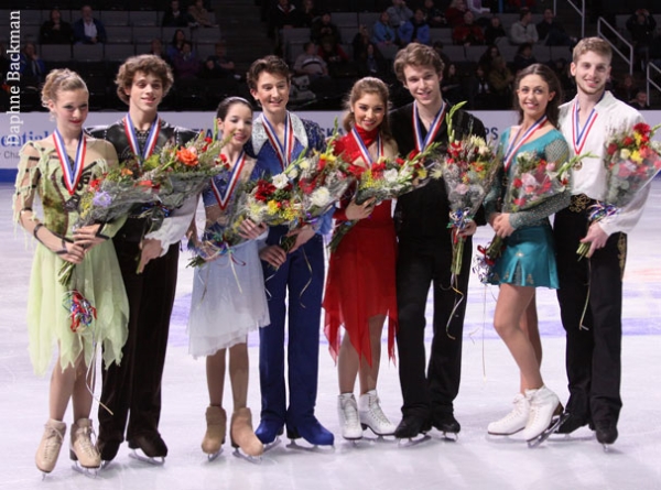 The junior ice dance medalists pose for photos The junior ice dance medalists pose for photos