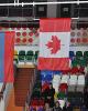 The medalists' flags are raised during the Canadian anthem