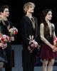 The skaters listen to the U.S. national anthem