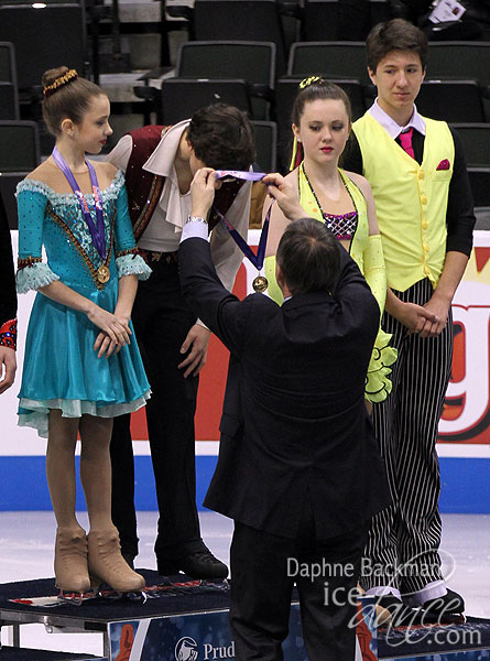 Gordon Green receives his medal from U.S. Figure Skating President Samuel Auxier