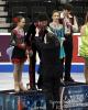 Caleb Wein receives his medal from U.S. Figure Skating President Samuel Auxier