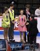 U.S. Figure Skating President Samuel Auxier congratulates the medalists